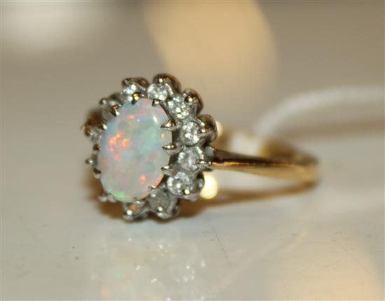 An 18ct gold, white opal and diamond ring